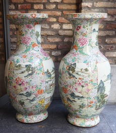 A large pair of Chinese famille rose millefleurs vases with landscape panels, Qianlong mark, 19th C.